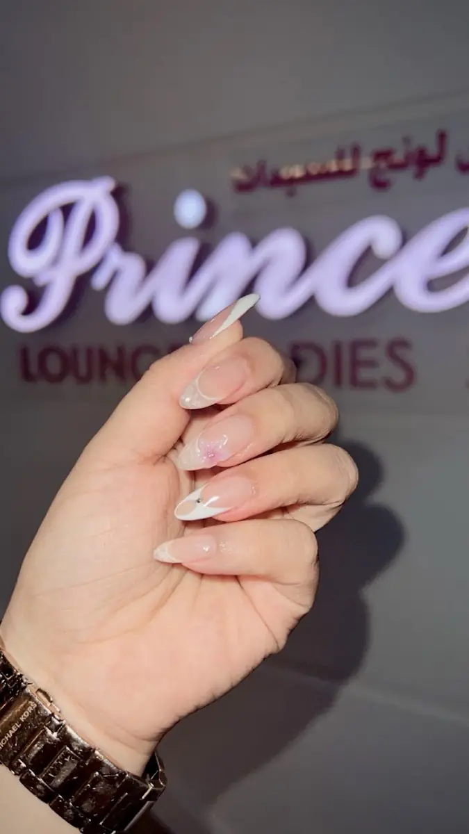 Nails in front of the Princess Lounge sign